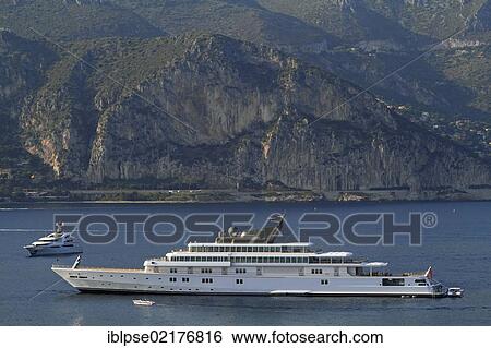 Motor yacht "Rising Sun", 138m, built by Luersson Yachts in 2004, owned by David Geffen, previously owned by Larry Ellison, Côte d'Azur, France, Mediterranean, Europe View Large Photo Image Stock Photograph - Motor yacht "Rising Sun", 138m, built by Luersson Yachts in 2004, owned by David Geffen, previously owned by Larry Ellison, Côte d'Azur, France, Mediterranean, Europe. Fotosearch