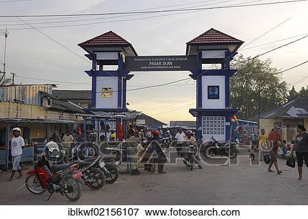 Stock Photo - Motorcycle parking and entrance to the fish market, Pasar Ikan, Kota Biak, Biak Island, Irian Jaya, Indonesia, Southeast Asia, Asia. Fotosearch