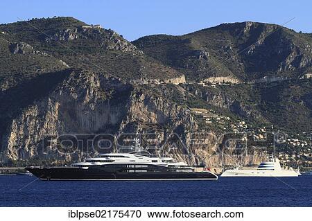 Motoryacht "Serene", 133. 9m, built in 2011 by yacht builder Fincantieri Yachts and owned by Yuri Scheffler, and motoryacht "A" on the Côte d'Azur, Eze at back, France, Mediterranean, Europe View Large Photo Image Stock Image - Motoryacht "Serene", 133. 9m, built in 2011 by yacht builder Fincantieri Yachts and owned by Yuri Scheffler, and motoryacht "A" on the Côte d'Azur, Eze at back, France, Mediterranean, Europe. Fotosearch