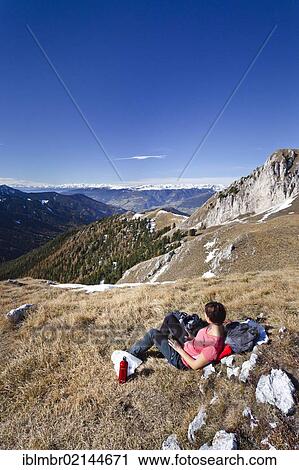 Mountaineer resting on the Kofelwiesen meadows while on the Herrensteig climbing route, overlooking the Villnoess Valley, Alto Adige, Italy, Europe View Large Photo Image Stock Image - Mountaineer resting on the Kofelwiesen meadows while on the Herrensteig climbing route, overlooking the Villnoess Valley, Alto Adige, Italy, Europe. Fotosearch