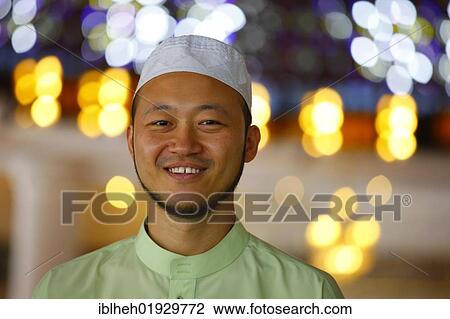 Stock Image - Muslim man, portrait, National Mosque, Kuala Lumpur, Malaysia, Southeast Asia, Asia. Fotosearch