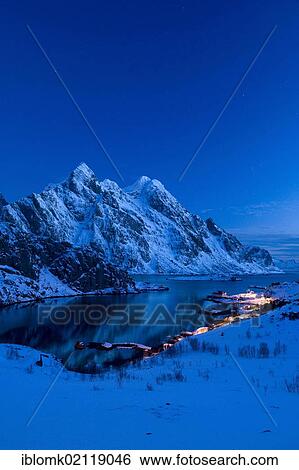 Stock Photograph - Mærvoll village, with Mount Himmeltindan, 964m, Lofoten Island of Vestvågøya, Lofoten Islands, North Norway, Norway, Europe. Fotosearch
