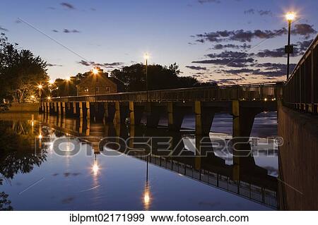 Stock Photo - New Mill and water flow control dam on the Mille-Iles river at dawn, Ile des Moulins, Old Terrebonne, Lanaudiere, Quebec, Canada, North America. Fotosearch