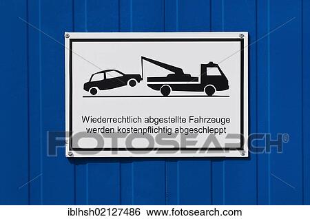 No parking sign with a pictogram and a message in German with a spelling mistake, Wiederrechtlich should be Widerrechtlich, on a blue metal garage door View Large Photo Image Stock Photograph - No parking sign with a pictogram and a message in German with a spelling mistake, Wiederrechtlich should be Widerrechtlich, on a blue metal garage door. Fotosearch