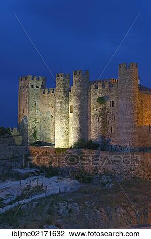 Stock Image - Obidos castle at dusk, now Hotel Pousada, Obidos, Leiria distric, Estremadura, Portugal, Europe. Fotosearch