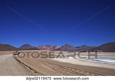 Off-road vehicle with a flat tyre, Altiplano, Potosi, southern Bolivia, South America View Large Photo Image Stock Image - Off-road vehicle with a flat tyre, Altiplano, Potosi, southern Bolivia, South America. Fotosearch