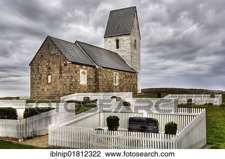 Stock Image - Old granite boulder church at the Danish west coast, Denmark, Europe. Fotosearch