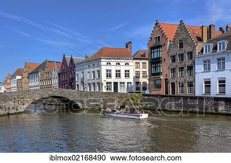 Old houses and a tourist boat on Lange Rei Canal, Bruges, West Flanders, Flemish Region, Belgium, Europe View Large Photo Image Stock Image - Old houses and a tourist boat on Lange Rei Canal, Bruges, West Flanders, Flemish Region, Belgium, Europe. Fotosearch