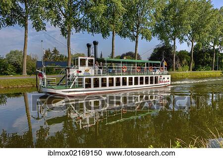 Old steamboat on a canal between Bruges and Damme, Damse Vaart-Zuid, Damme, Bruges, West Flanders, Flemish Region, Belgium, Europe View Large Photo Image Stock Image - Old steamboat on a canal between Bruges and Damme, Damse Vaart-Zuid, Damme, Bruges, West Flanders, Flemish Region, Belgium, Europe. Fotosearch