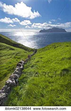 Picture - Old stone walls, view towards Mykines Island, Gásadalur, Vágar, Faroe Islands, Denmark, North Atlantic, Europe. Fotosearch
