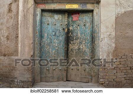 Old wooden door with blue paint in an alley of the Uighur residential district, Uyghurs, Silk Road, Xinjiang, China, Asia View Large Photo Image Stock Image - Old wooden door with blue paint in an alley of the Uighur residential district, Uyghurs, Silk Road, Xinjiang, China, Asia. Fotosearch