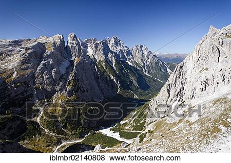 On the Alpinisteig climbing trail, Mt. Einser ahead, Dreischusterspitze peak in the back, Sexten, South Tyrol, Dolomites, South Tyrol, Italy, Europe View Large Photo Image Stock Photo - On the Alpinisteig climbing trail, Mt. Einser ahead, Dreischusterspitze peak in the back, Sexten, South Tyrol, Dolomites, South Tyrol, Italy, Europe. Fotosearch