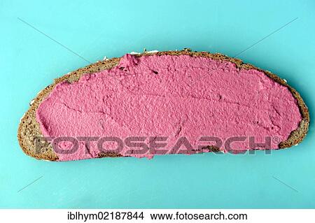 Organic bread with a horseradish-beetroot spread on a cutting board View Large Photo Image Picture - Organic bread with a horseradish-beetroot spread on a cutting board. Fotosearch
