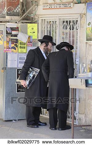 Orthodox Jews having a conversation in front of wall newspapers in the district of Me'a She'arim or Mea Shearim, Jerusalem, Israel, Middle East, Asia View Large Photo Image Stock Photography - Orthodox Jews having a conversation in front of wall newspapers in the district of Me'a She'arim or Mea Shearim, Jerusalem, Israel, Middle East, Asia. Fotosearch