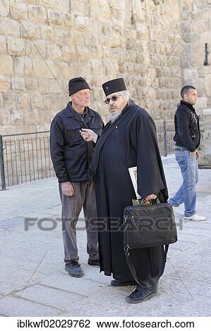 Stock Image - Orthodox priest near the Jaffa Gate in the Christian Quarter in the Old City of Jerusalem, Israel, Middle East, Asia. Fotosearch