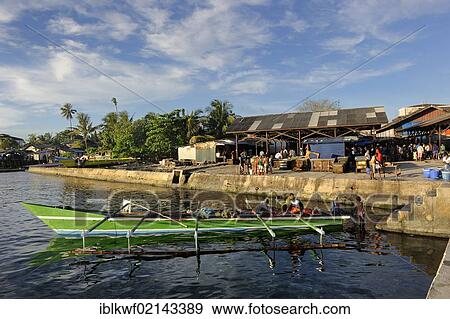 Outrigger at the fish market in Kota Biak, Biak Island, West Papua, Indonesia, Southeast Asia, Asia View Large Photo Image Stock Photo - Outrigger at the fish market in Kota Biak, Biak Island, West Papua, Indonesia, Southeast Asia, Asia. Fotosearch