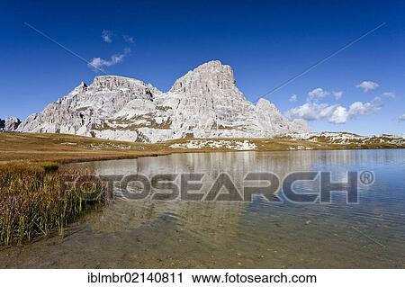 Stock Image - Overlooking one of the Boedenseen lakes, descent from the Three Peaks hut, behind the Schusterplatte, Sexten, South Tyrol, Dolomites, South Tyrol, Italy, Europe. Fotosearch