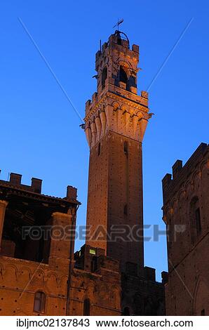 Palazzo Comunale and Torre del Mangia tower at dusk, Siena, Tuscany, Italy, Europe View Large Photo Image Stock Image - Palazzo Comunale and Torre del Mangia tower at dusk, Siena, Tuscany, Italy, Europe. Fotosearch