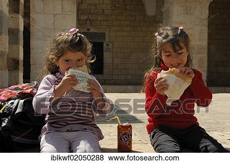 Palestinian children eating falafel on the Temple Mount, Muslim Quarter, Old City, Jerusalem, Israel, Middle East, Asia View Large Photo Image Stock Photo - Palestinian children eating falafel on the Temple Mount, Muslim Quarter, Old City, Jerusalem, Israel, Middle East, Asia. Fotosearch