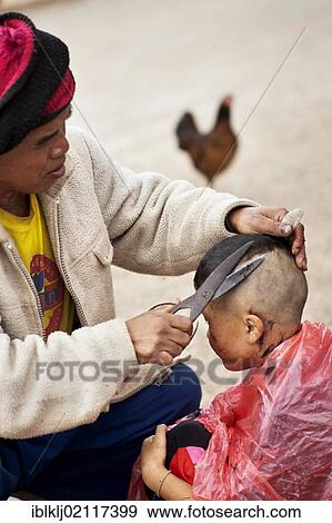 Palong boy getting a haircut at the roadside in Norlae village, northern Thailand, Asia View Large Photo Image Stock Photo - Palong boy getting a haircut at the roadside in Norlae village, northern Thailand, Asia. Fotosearch