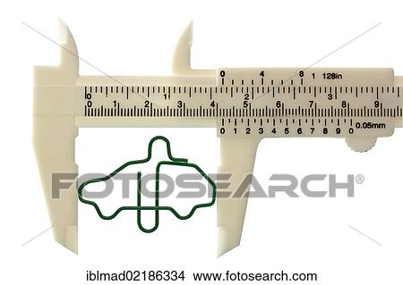 Paper clip shaped like a car, in a sliding caliper, symbolic image for cost of maintenance of a car View Large Photo Image Picture - Paper clip shaped like a car, in a sliding caliper, symbolic image for cost of maintenance of a car. Fotosearch