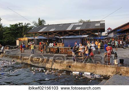 Papuans gutting fish that were bought at the fish market, floating plastic debris at front, Kota Biak, Biak Island, Irian Jaya, Indonesia, Southeast Asia, Asia View Large Photo Image Stock Image - Papuans gutting fish that were bought at the fish market, floating plastic debris at front, Kota Biak, Biak Island, Irian Jaya, Indonesia, Southeast Asia, Asia. Fotosearch