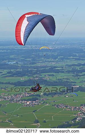 Paraglider in the air, Tegelberg Mountain, Upper Bavaria, Bavaria, Germany, Europe, PublicGround, Europe View Large Photo Image Stock Photo - Paraglider in the air, Tegelberg Mountain, Upper Bavaria, Bavaria, Germany, Europe, PublicGround, Europe. Fotosearch