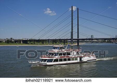 Stock Image - Passenger ship "Duesseldorf" on the Rhine river near the Oberkassel Bridge, Duesseldorf, North Rhine-Westphalia, Germany, Europe. Fotosearch