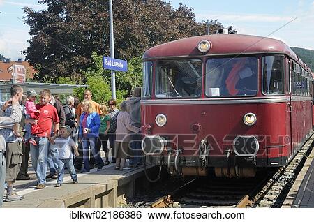 Passengers boarding the German Uerdinger railcar in the train station of Bad Laasphe, Siegen Wittgenstein district, North Rhine-Westphalia, Germany, Europe View Large Photo Image Stock Photograph - Passengers boarding the German Uerdinger railcar in the train station of Bad Laasphe, Siegen Wittgenstein district, North Rhine-Westphalia, Germany, Europe. Fotosearch
