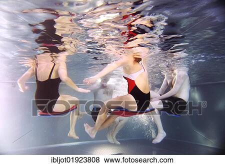 Patients doing aqua aerobics, water aerobics, exercise therapy, physiotherapy in water, e. g. as a rehabilitation program, in a hospital in Germany, Europe View Large Photo Image Stock Photo - Patients doing aqua aerobics, water aerobics, exercise therapy, physiotherapy in water, e. g. as a rehabilitation program, in a hospital in Germany, Europe. Fotosearch