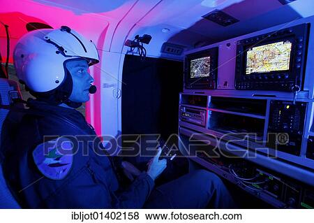 Patrol helicopter with night flying capability, image intensifier, infrared camera, pilot with night vision gear, night mission, flight operator operating searchlights and cameras, police flying squadron NRW, Duesseldorf, North Rhine-Westphalia,... View Large Photo Image Stock Photo - Patrol helicopter with night flying capability, image intensifier, infrared camera, pilot with night vision gear, night mission, flight operator operating searchlights and cameras, police flying squadron NRW, Duesseldorf, North Rhine-Westphalia,.... Fotosearch