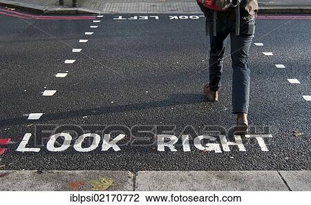 Stock Image - Pedestrian crossing street, Look Right marking, London, England, United Kingdom, Europe. Fotosearch