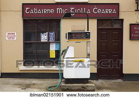 Stock Image - Petrol station and pub, with Gaelic lettering, Kilcar, County Donegal, Ireland, Europe, PublicGround, Europe. Fotosearch