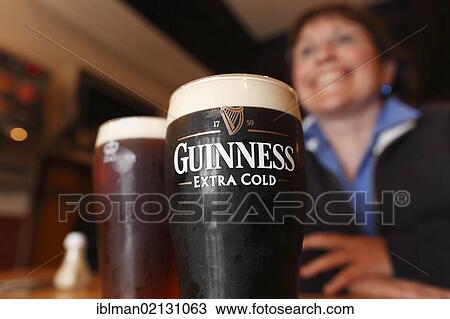 Stock Image - Pint of Guinness, stout beer, Mary McBride's Pub, Cushendun, County Antrim, Northern Ireland, United Kingdom, Europe. Fotosearch