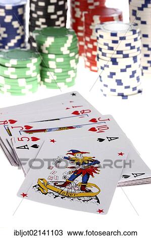 Stock Image - Poker, playing cards, gaming chips, tokens, with different values, joker card. Fotosearch