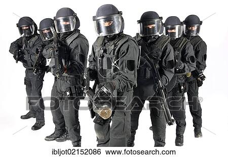 Police, Special Task Force, SEK, squad holding a metal battering ram and various weapons View Large Photo Image Stock Photograph - Police, Special Task Force, SEK, squad holding a metal battering ram and various weapons. Fotosearch