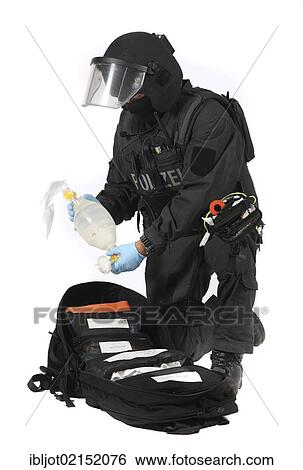 Stock Photograph - Police, Special Task Force, SEK, paramedic, providing first aid during an operation. Fotosearch