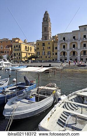 Stock Image - Port and bell tower, Campanile of the Romanesque cathedral Duomo dei Santi Erasmo e Marciano, Gaeta, Lazio, Italy, Europe. Fotosearch
