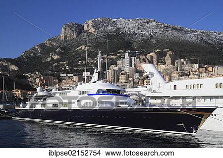 Port Hercule with a motor yacht, The One, in winter, Principality of Monaco, Côte d'Azur, Mediterranean Sea, Europe View Large Photo Image Picture - Port Hercule with a motor yacht, The One, in winter, Principality of Monaco, Côte d'Azur, Mediterranean Sea, Europe. Fotosearch