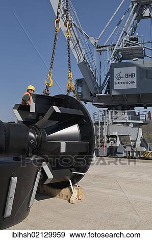 Stock Photo - Port of Bonn, loading of machine parts with a crane, North Rhine-Westphalia, Germany, Europe. Fotosearch