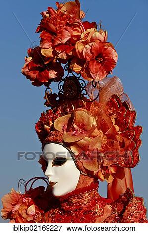 Stock Photo - Portrait of woman dressed in red during the Carnival of Venice, Italy, Europe. Fotosearch