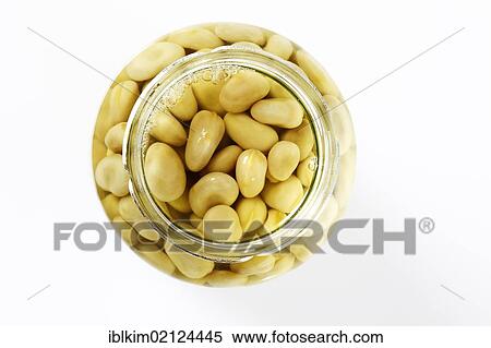 Stock Photography - Preserved food, open glass of thick beans. Fotosearch