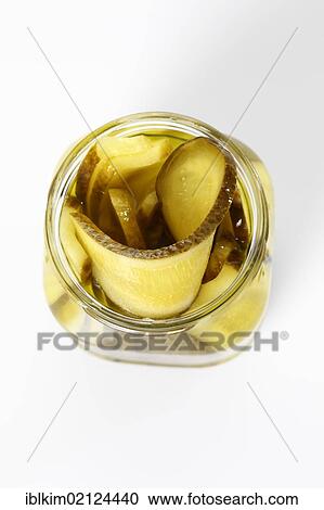 Preserved food, open jar of pickles, sliced cucumber View Large Photo Image Stock Image - Preserved food, open jar of pickles, sliced cucumber. Fotosearch