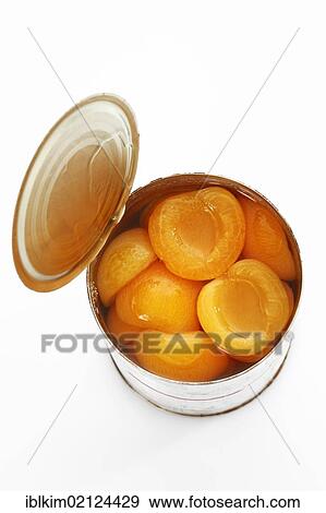 Preserved food, opened tin of apricot halves View Large Photo Image Stock Photo - Preserved food, opened tin of apricot halves. Fotosearch