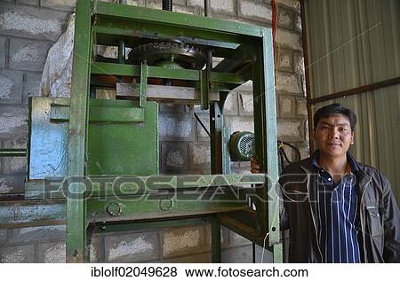 Production of Tibetan incense sticks, machine for pressing the incense mass, Tibet, China, Asia View Large Photo Image Stock Photo - Production of Tibetan incense sticks, machine for pressing the incense mass, Tibet, China, Asia. Fotosearch