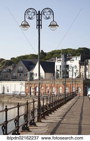 Promenade with railings and street lamp in Swanage, Dorset, England, United Kingdom, Europe View Large Photo Image Stock Photo - Promenade with railings and street lamp in Swanage, Dorset, England, United Kingdom, Europe. Fotosearch