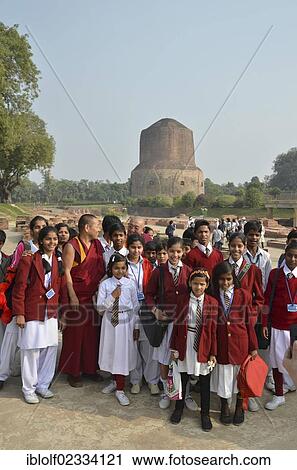 Pupils of an Indian school class, boys and girls, with Tibetan monks and a Rinpoche visiting the Dhamekh Stupa, Game Park of Isipatana, Sarnath, Uttar Pradesh, Indian, South Asia, Asia View Large Photo Image Stock Image - Pupils of an Indian school class, boys and girls, with Tibetan monks and a Rinpoche visiting the Dhamekh Stupa, Game Park of Isipatana, Sarnath, Uttar Pradesh, Indian, South Asia, Asia. Fotosearch