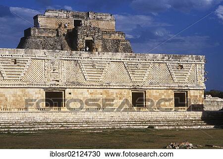 Stock Image - Pyramid of the Soothsayers and the Square of the Nuns, Puuc Mayan ruins of Uxmal, Yucatan, Mexico, North America. Fotosearch
