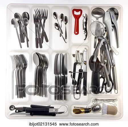 Stock Photography - Rack drawer for cutlery, various kitchen tools. Fotosearch