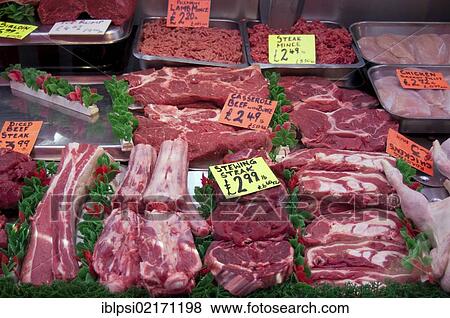 Raw cuts of meat on display in butcher shop in London, England, United Kingdom, Europe View Large Photo Image Stock Photo - Raw cuts of meat on display in butcher shop in London, England, United Kingdom, Europe. Fotosearch